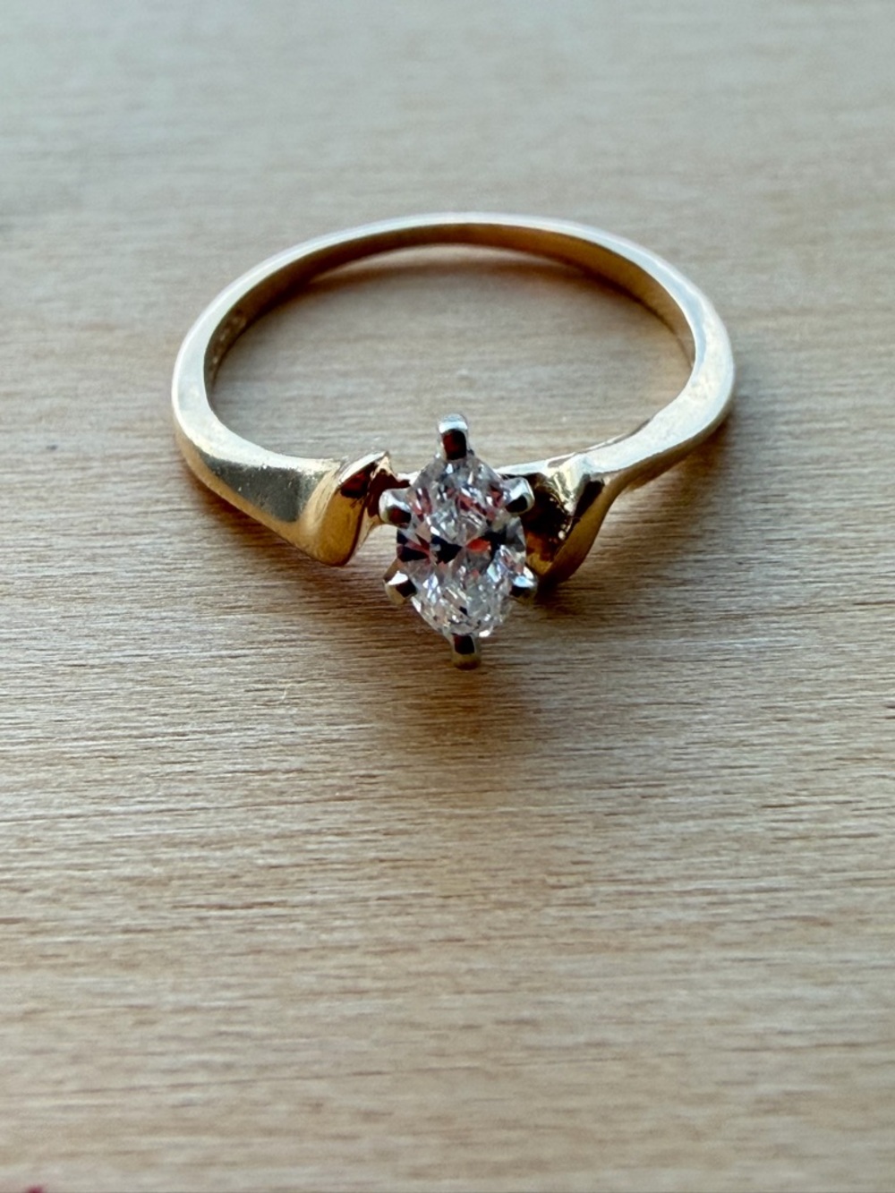 Classic Gold Solitaire Ring with Clear Marquise Stone